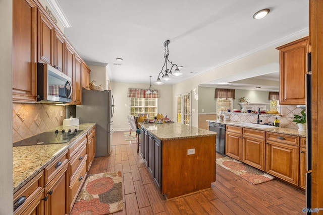 kitchen featuring stainless steel appliances, light stone counters, dark wood-style flooring, and crown molding