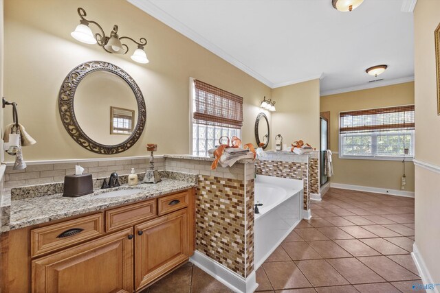 bathroom featuring tile patterned floors, vanity, crown molding, and a healthy amount of sunlight