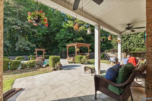 view of patio featuring a pergola and ceiling fan