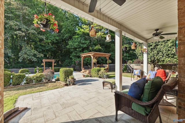 view of patio / terrace featuring ceiling fan, outdoor lounge area, fence, and a pergola