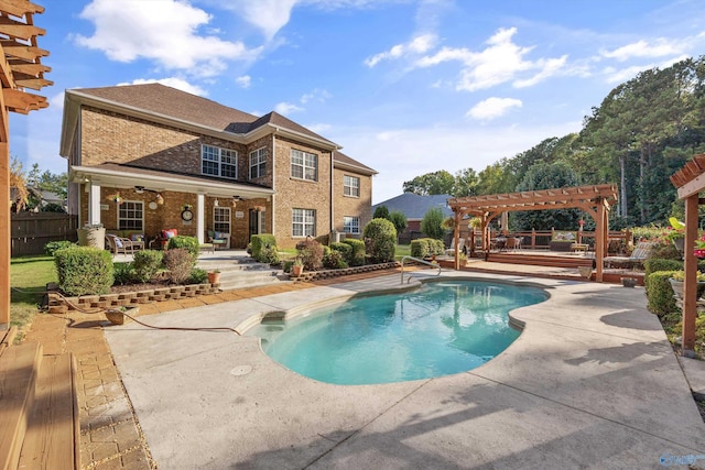 outdoor pool with a ceiling fan, fence, a patio, and a pergola