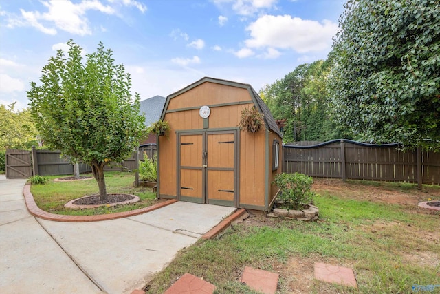 view of shed with a fenced backyard