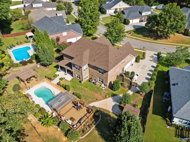 birds eye view of property with a residential view