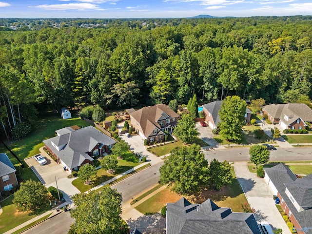 aerial view featuring a residential view and a view of trees