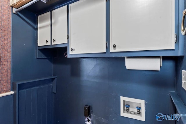 laundry room featuring hookup for a washing machine and cabinets