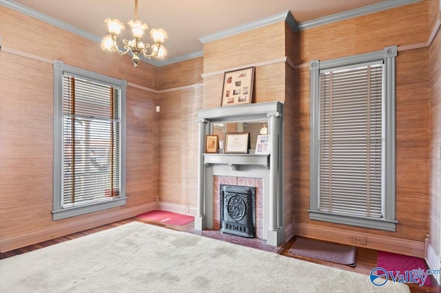 unfurnished living room featuring a notable chandelier and crown molding