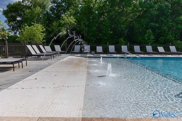 view of swimming pool featuring a patio area