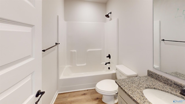 full bathroom with vanity, shower / tub combination, toilet, and wood-type flooring