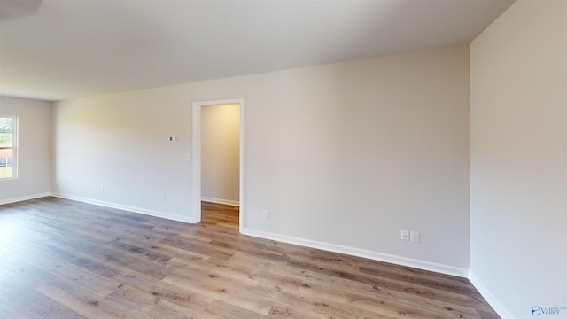 spare room featuring light wood-type flooring