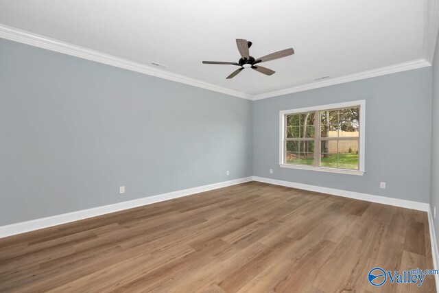 unfurnished room featuring ceiling fan, light wood-type flooring, and ornamental molding