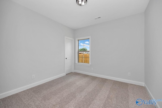 unfurnished room with carpet floors