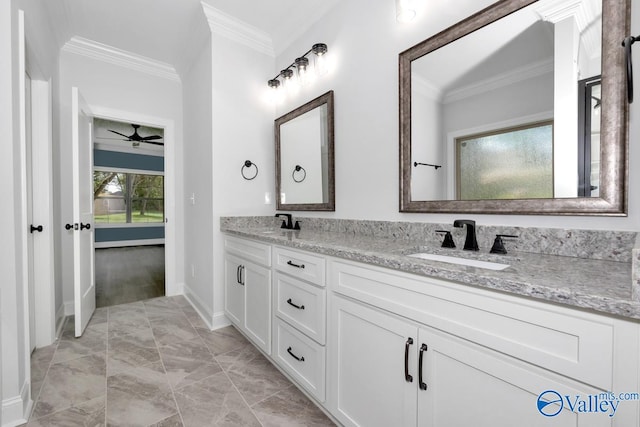 bathroom featuring ceiling fan, vanity, and ornamental molding