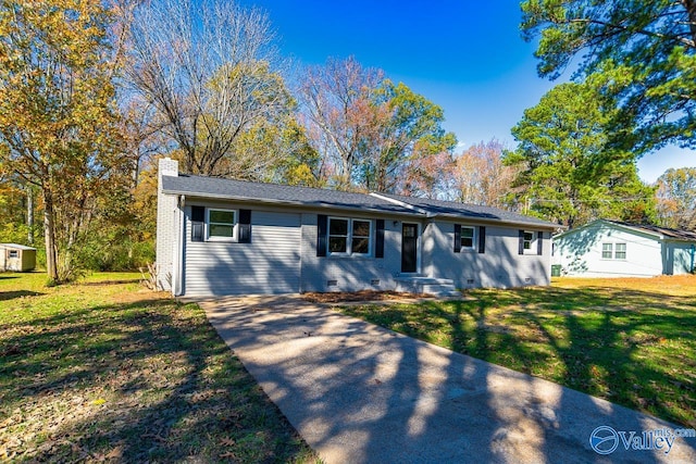 single story home featuring a front yard