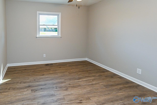 unfurnished room featuring dark hardwood / wood-style floors and ceiling fan