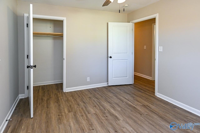 unfurnished bedroom featuring a closet, ceiling fan, and dark hardwood / wood-style flooring