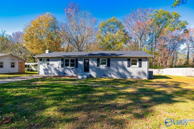 ranch-style home featuring a front yard