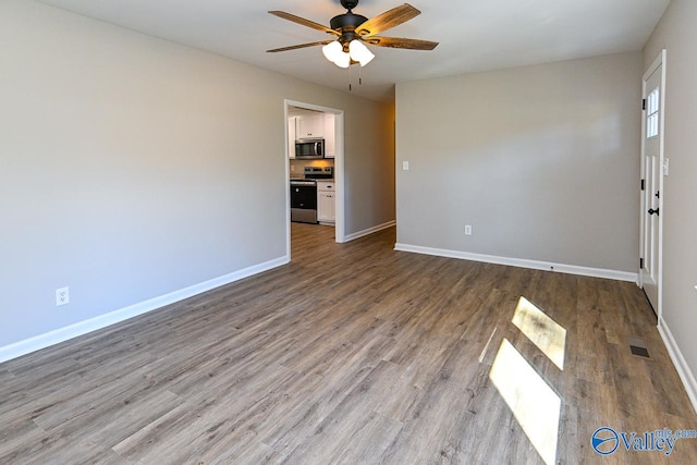 unfurnished room featuring ceiling fan and light hardwood / wood-style flooring