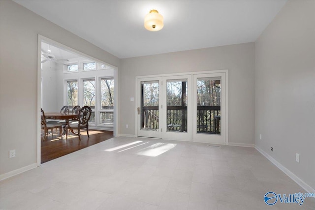 empty room featuring light wood-type flooring and ceiling fan