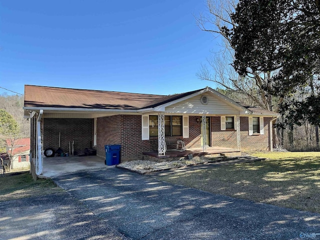 ranch-style house with a porch and a carport