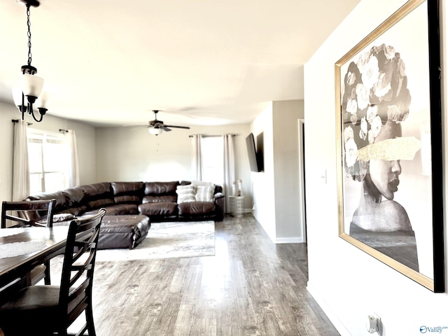 living room featuring hardwood / wood-style floors and ceiling fan