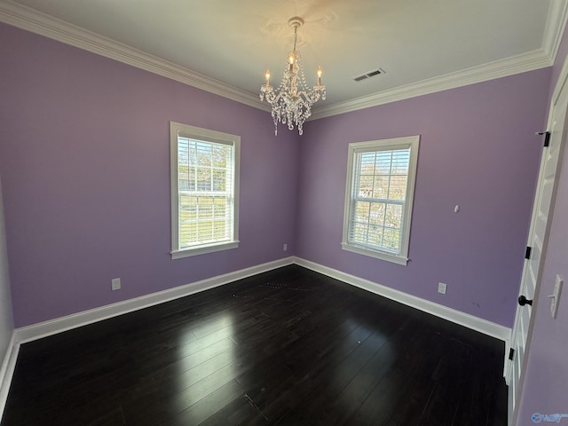 empty room featuring plenty of natural light, visible vents, dark wood finished floors, and a chandelier