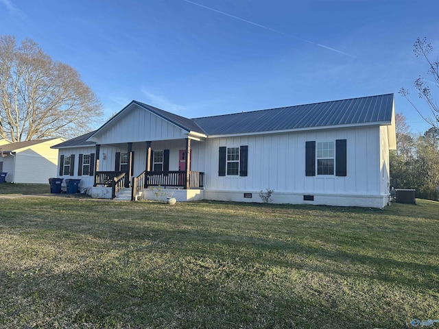 view of front of home featuring board and batten siding, crawl space, central AC, and a front lawn