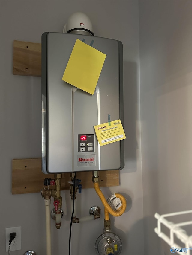 utility room with water heater
