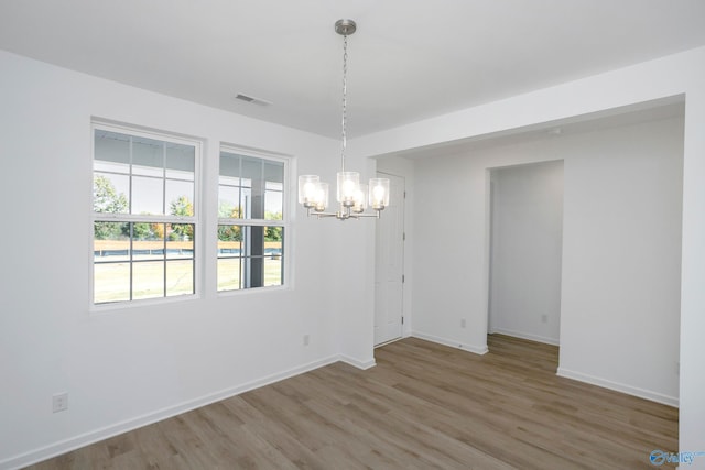 unfurnished dining area featuring hardwood / wood-style floors