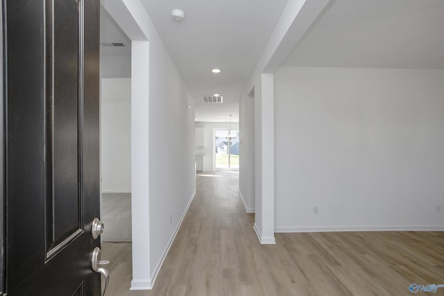 corridor with light wood-type flooring