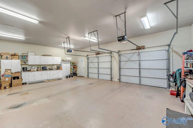 garage featuring a garage door opener