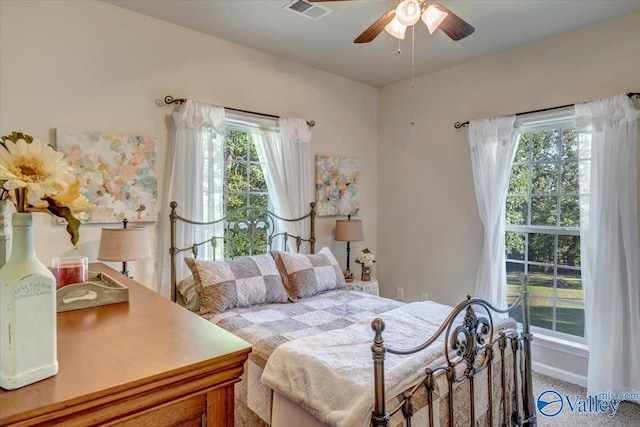 carpeted bedroom with ceiling fan