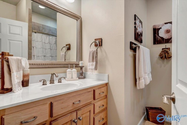 bathroom featuring vanity and a shower with curtain