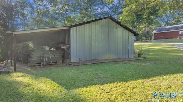 view of outbuilding with a yard