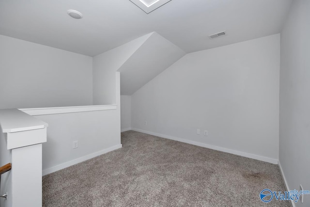 bonus room featuring vaulted ceiling, carpet floors, visible vents, and baseboards