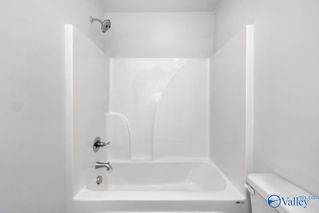 bathroom featuring toilet and shower / bath combination