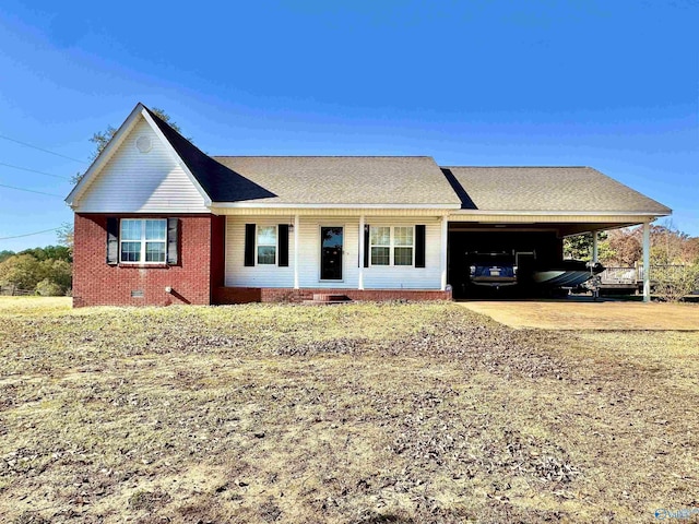 ranch-style house featuring a carport