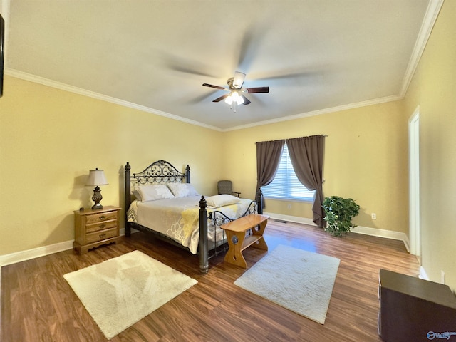 bedroom with ceiling fan, ornamental molding, and dark wood-type flooring