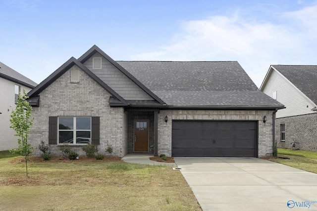 269 Shubert Dr, Hazel Green, AL 35750 - view of front facade with a garage, a front lawn, driveway, and brick siding