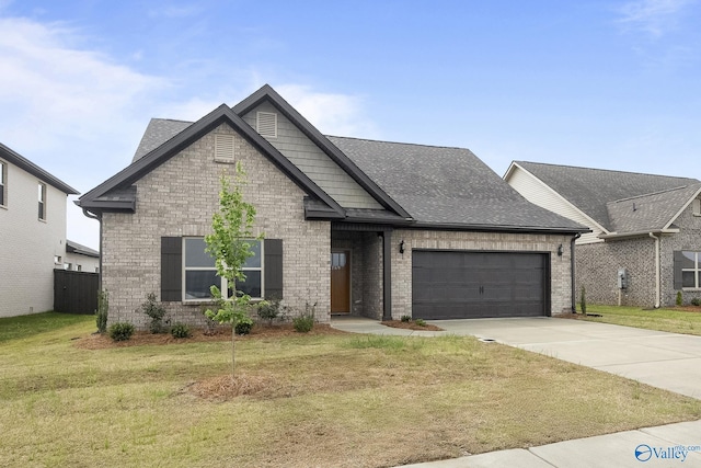 269 Shubert Dr, Hazel Green, AL 35750 - view of front facade with a garage, a front lawn, concrete driveway, and brick siding