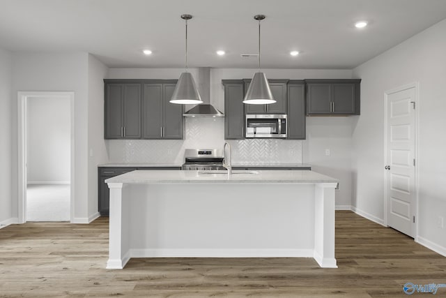 269 Shubert Dr, Hazel Green, AL 35750 - kitchen featuring wall chimney exhaust hood, appliances with stainless steel finishes, a sink, gray cabinets, and recessed lighting