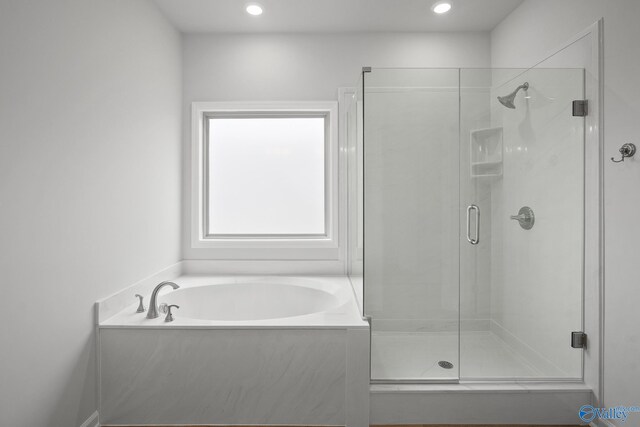 269 Shubert Dr, Hazel Green, AL 35750 - bathroom with a stall shower, a bath, and recessed lighting