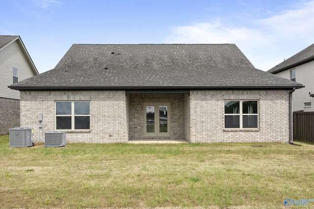 269 Shubert Dr, Hazel Green, AL 35750 - back of house with central air condition unit, brick siding, and roof with shingles