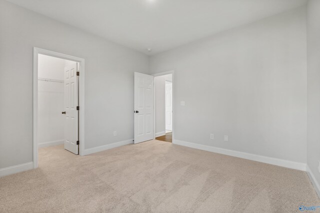 unfurnished living room featuring crown molding, dark wood-type flooring, and ceiling fan