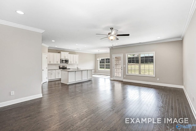 unfurnished living room featuring ceiling fan, ornamental molding, sink, and dark hardwood / wood-style flooring