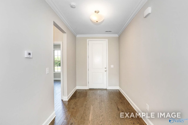 foyer featuring hardwood / wood-style flooring and crown molding