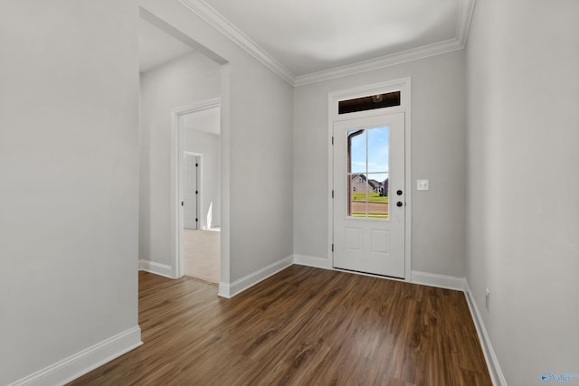 foyer featuring crown molding, baseboards, and wood finished floors