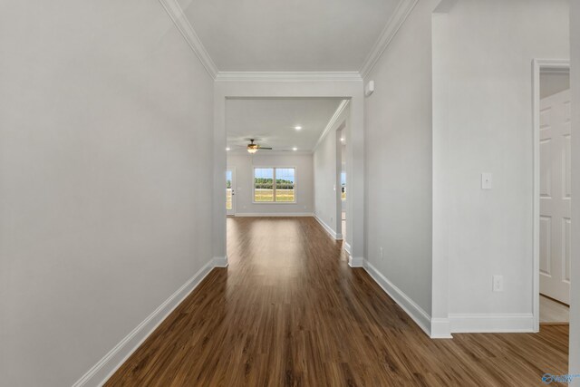 unfurnished room featuring ornamental molding, dark hardwood / wood-style flooring, and ceiling fan