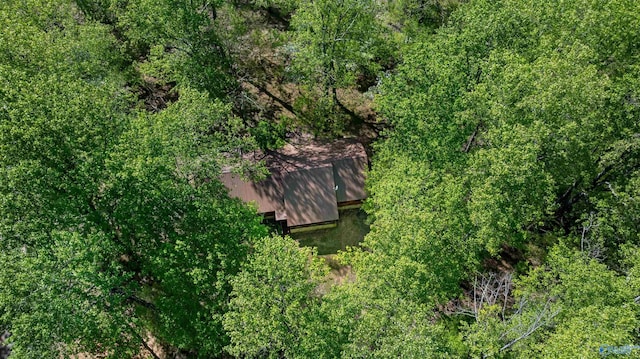 aerial view featuring a wooded view