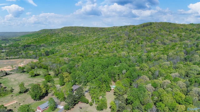 aerial view with a mountain view and a wooded view
