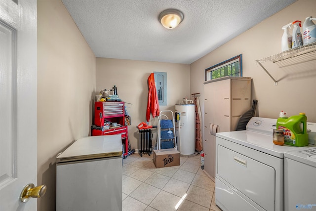 clothes washing area featuring electric panel, a textured ceiling, water heater, washer and dryer, and laundry area